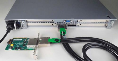 Back panel of EDT EXP4 1U expansion system showing case, power cable, PCIe host adapter, and PCIe cable. 