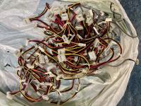 Large bulk collection of internal IDE Power Y-splitter cables with 4-pin Molex connectors, featuring identification labels for 'SYSTEM', 'HDD 0', and 'IDE Power Cable'.